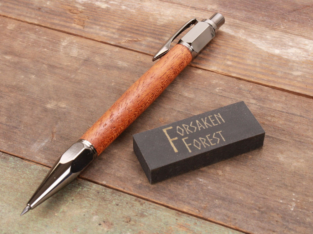 
                  
                    African Mahogany 2mm mechanical pencil with black eraser by Forsaken Forest Designs.
                  
                