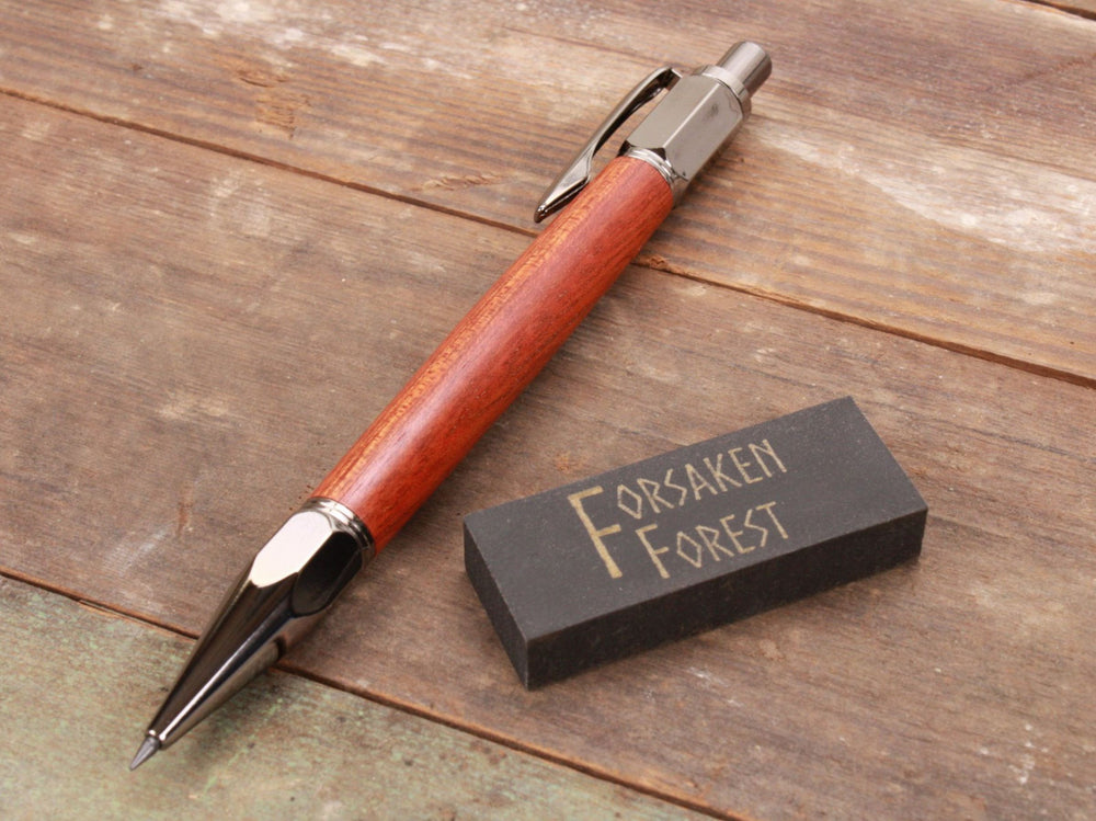 
                  
                    Bloodwood 2mm mechanical pencil with black eraser by Forsaken Forest Designs.
                  
                