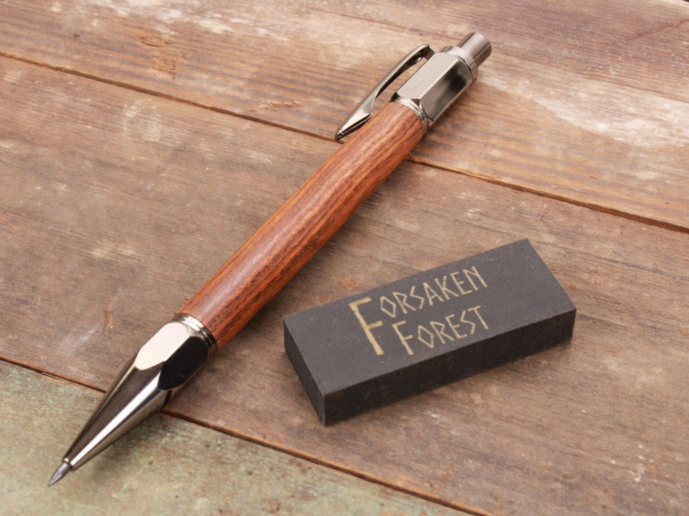 
                  
                    Chechen (Black Poisonwood) 2mm mechanical pencil with black eraser by Forsaken Forest Gaming.
                  
                