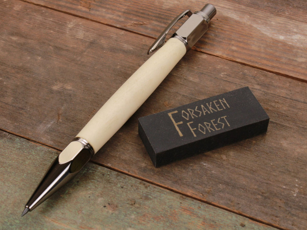 
                  
                    Holly wood 2mm mechanical pencil with black eraser by Forsaken Forest Gaming.
                  
                