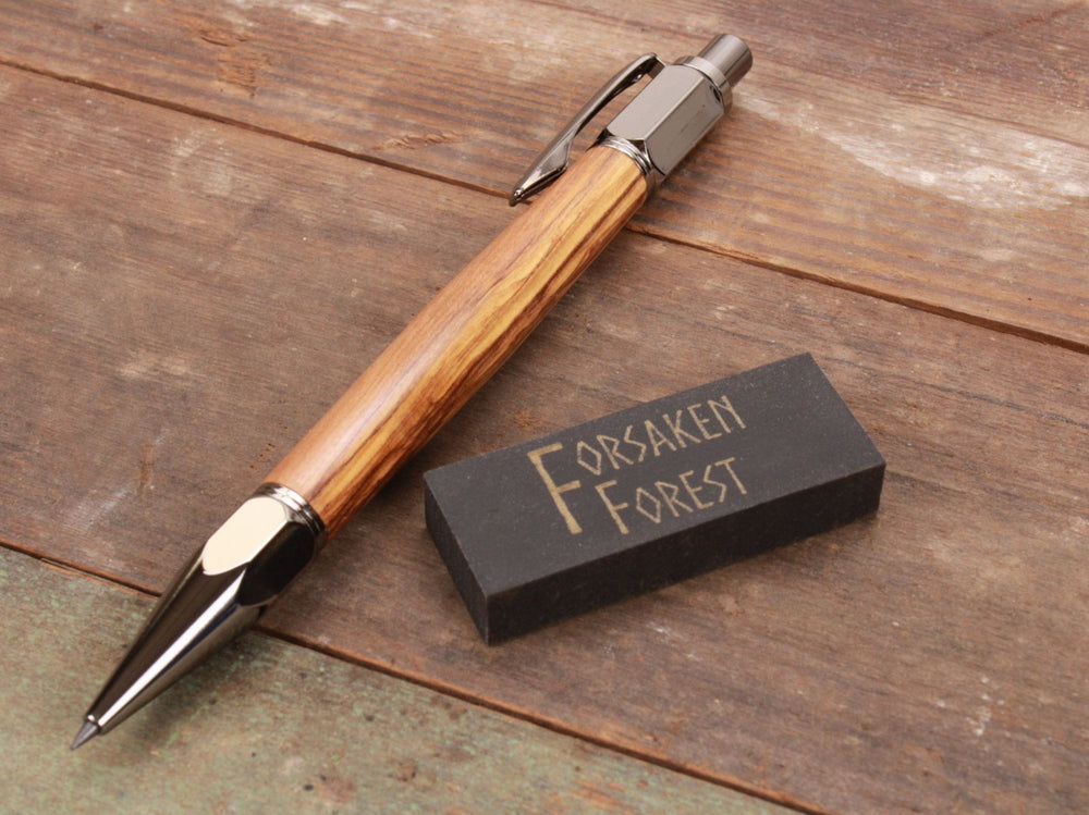 
                  
                    Olive wood 2mm mechanical pencil with black eraser by Forsaken Forest Gaming.
                  
                