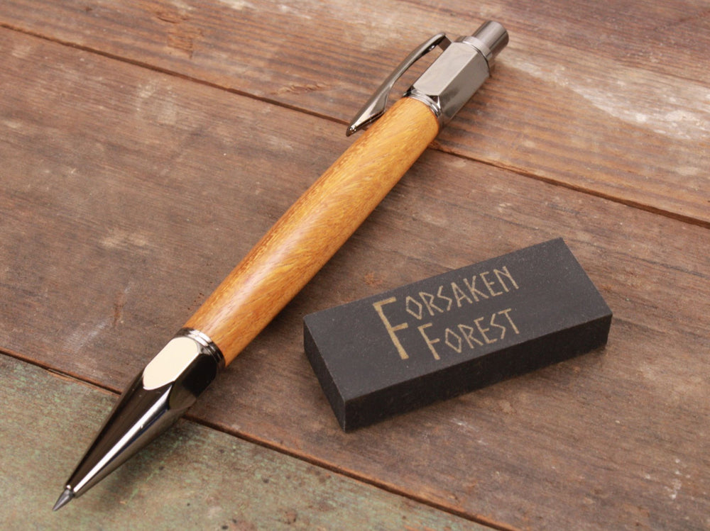 
                  
                    Osage Orange Argentine wood 2mm mechanical pencil with black eraser by Forsaken Forest Gaming.
                  
                