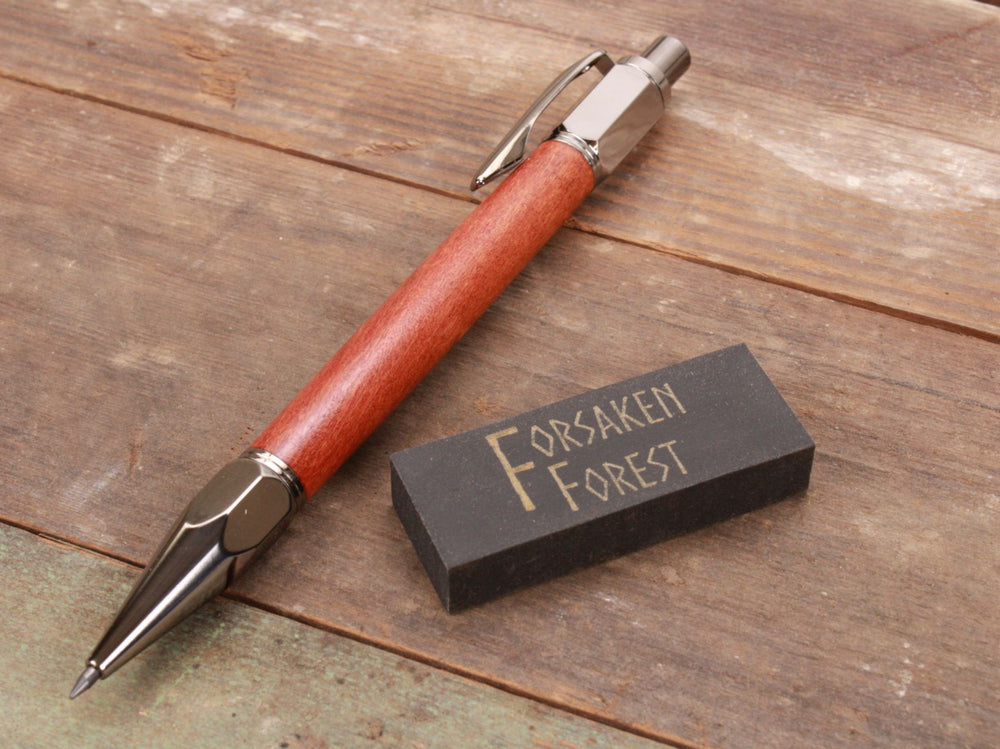 
                  
                    Pink Ivory wood 2mm mechanical pencil with black eraser by Forsaken Forest Gaming.
                  
                