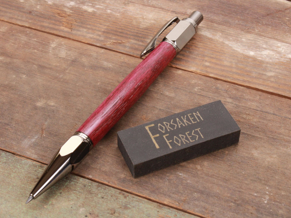 
                  
                    Purpleheart wood 2mm mechanical pencil with black eraser by Forsaken Forest Gaming.
                  
                
