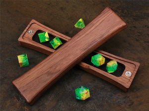 
                  
                    Handcrafted Black Walnut Dice Box with Standard Foam Liner Displaying Bright Green and Yellow Polyhedral Dice. Lid Rests Diagonally Face Down Over Base. Perfect for Gamers and Collectors
                  
                