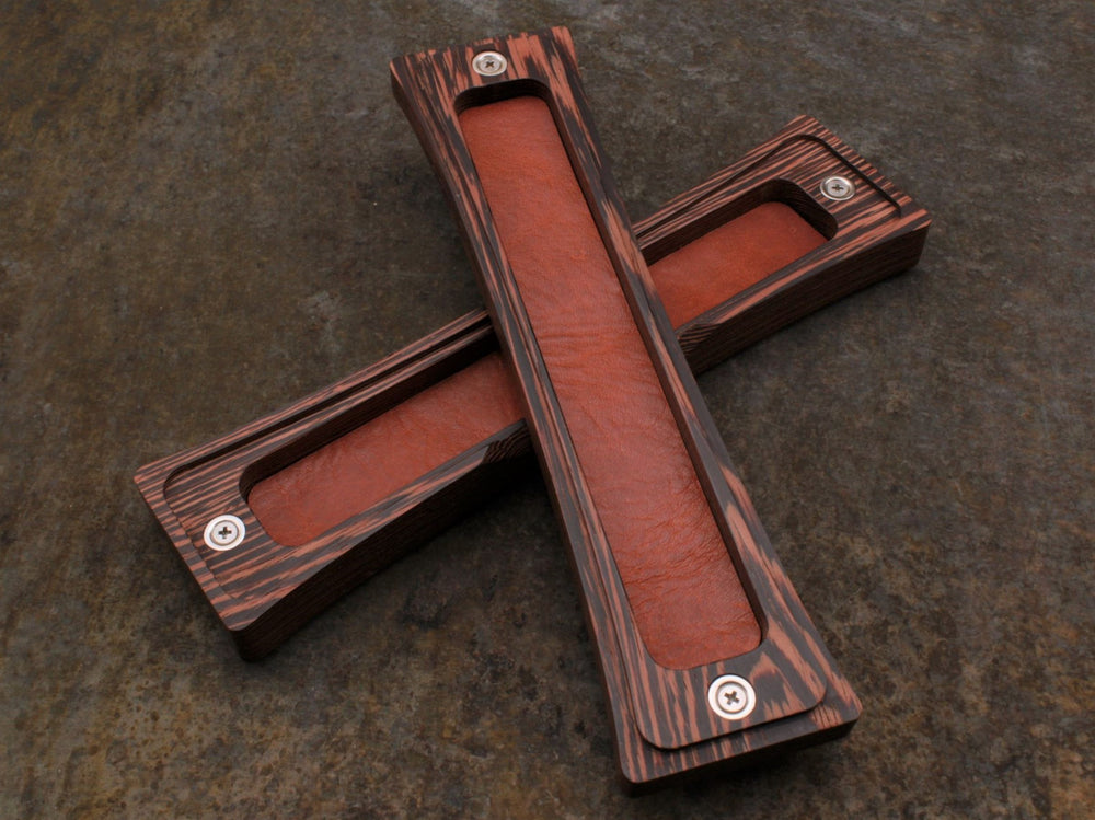 
                  
                    Wenge wood dice box with brown leather liner by Forsaken Forest Gaming.
                  
                