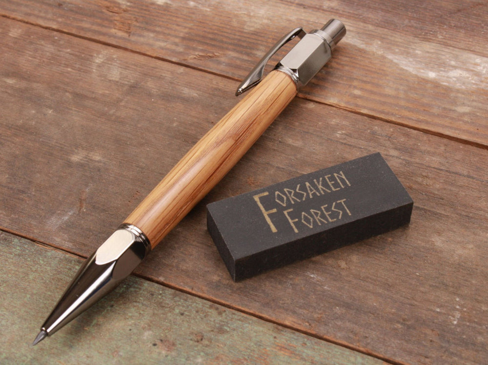 
                  
                    White Oak wood 2mm mechanical pencil with black eraser by Forsaken Forest Gaming.
                  
                